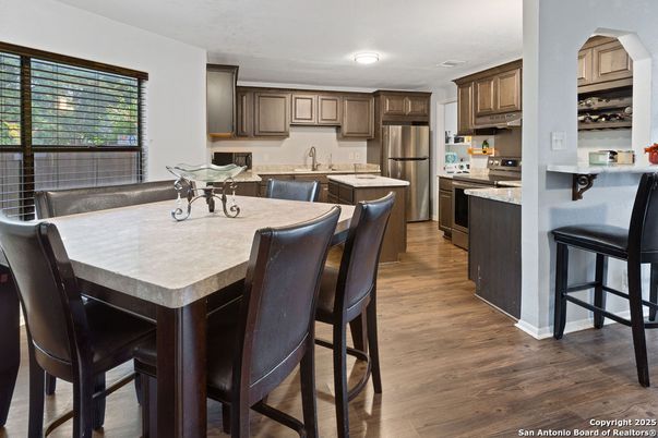 Dining room, Interior, Kitchen, Recessed Lighting, Stainless Steel Appliances, Wood Texture Flooring