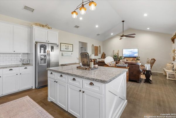 Dining room, Interior, Kitchen, Living room, Recessed Lighting, Stainless Steel Appliances, Wood Texture Flooring