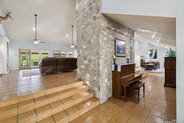 Dining room, Interior, Pendant Lights, Piano, Recessed Lighting, Stone Walls