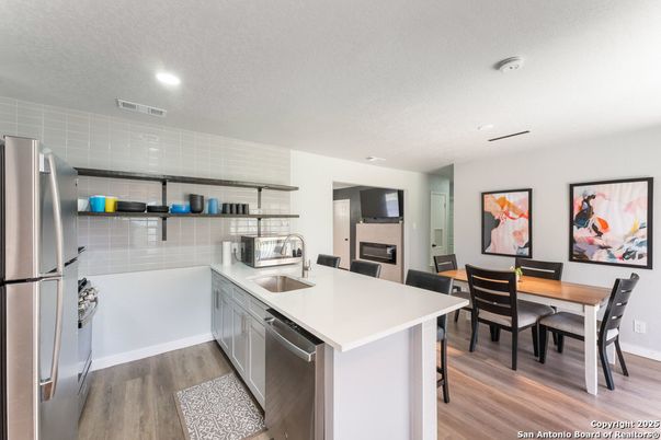 Dining room, Interior, Kitchen, Recessed Lighting, Stainless Steel Appliances, Wood Texture Flooring
