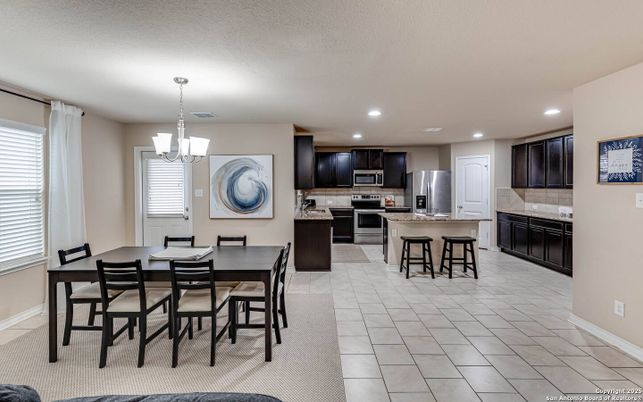 Chandelier, Dining room, Interior, Kitchen, Pendant Lights, Recessed Lighting, Stainless Steel Appliances