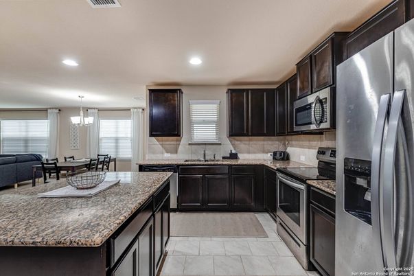 Chandelier, Dining room, Interior, Kitchen, Pendant Lights, Recessed Lighting, Stainless Steel Appliances