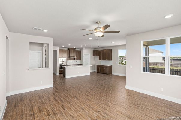 Empty room, Interior, Kitchen, Recessed Lighting, Stainless Steel Appliances, Wood Texture Flooring