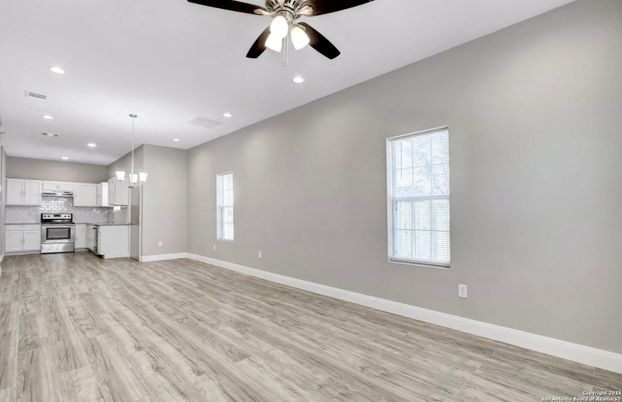 Chandelier, Empty room, Interior, Kitchen, Pendant Lights, Recessed Lighting, Stainless Steel Appliances, Wood Texture Flooring