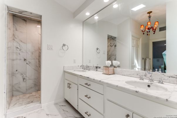 Bathroom, Chandelier, Dual Sink Vanities, Interior, Marble, Marble Walls, Recessed Lighting