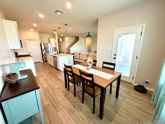 Dining room, Interior, Kitchen, Pendant Lights, Recessed Lighting, Stainless Steel Appliances, Wood Texture Flooring