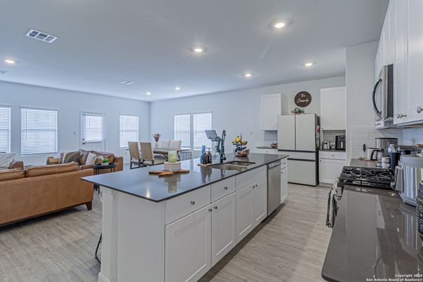Dining room, Interior, Kitchen, Living room, Recessed Lighting, Stainless Steel Appliances, Wood Texture Flooring