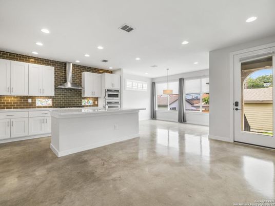 Empty room, Interior, Kitchen, Pendant Lights, Recessed Lighting, Stainless Steel Appliances, Stone Walls