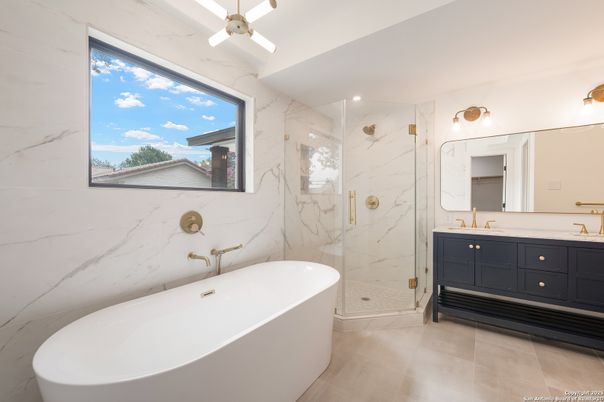 Bathroom, Free Standing Baths, Glass Shower, Interior, Marble Walls, Recessed Lighting