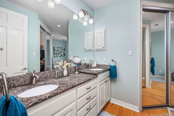 Bathroom, Dual Sink Vanities, Interior, Recessed Lighting, Wood Texture Flooring