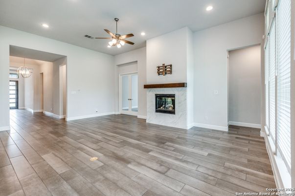 Empty room, Fireplace, Interior, Pendant Lights, Recessed Lighting, Wood Texture Flooring