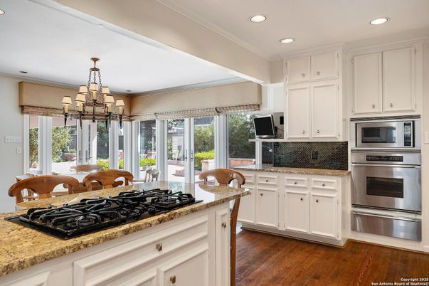 Chandelier, Interior, Kitchen, Recessed Lighting, Stainless Steel Appliances, Wood Texture Flooring