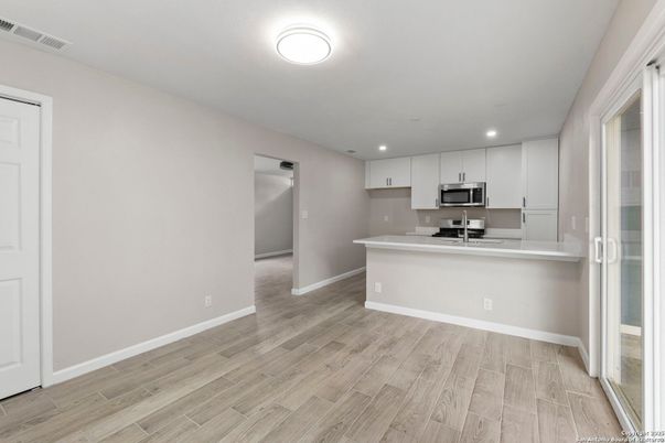 Interior, Kitchen, Recessed Lighting, Stainless Steel Appliances, Wood Texture Flooring