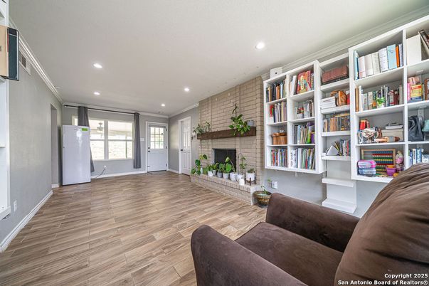 Fireplace, Interior, Living room, Recessed Lighting, Stone Walls, Wood Texture Flooring