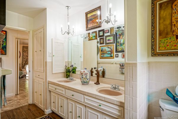 Bathroom, Chandelier, Dual Sink Vanities, Interior, Tile Countertops, Wood Texture Flooring