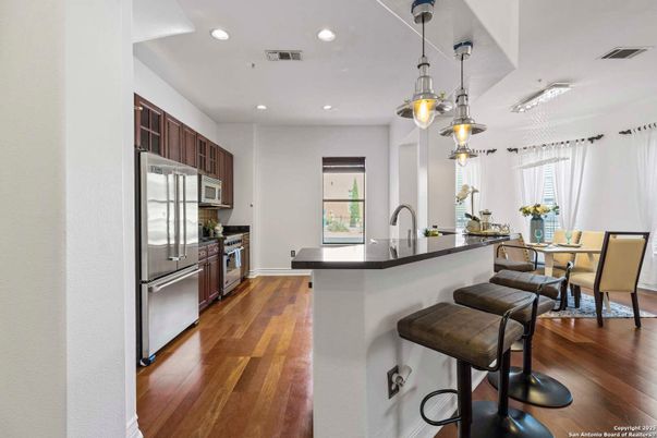Dining room, Interior, Kitchen, Pendant Lights, Recessed Lighting, Stainless Steel Appliances, Wood Texture Flooring