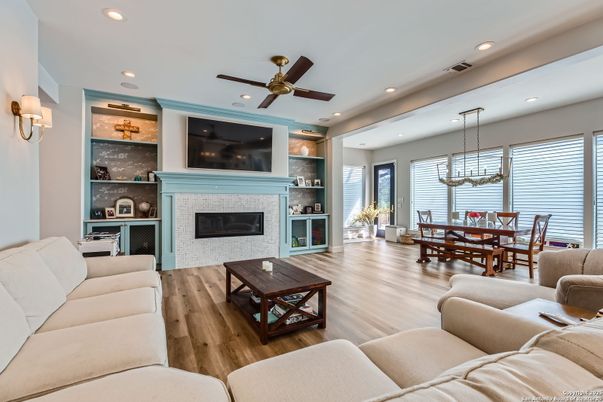 Dining room, Fireplace, Interior, Living room, Pendant Lights, Recessed Lighting, Wood Texture Flooring