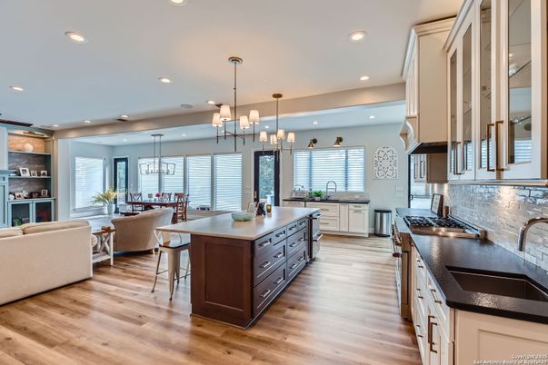 Chandelier, Dining room, Interior, Kitchen, Living room, Pendant Lights, Recessed Lighting, Wood Texture Flooring