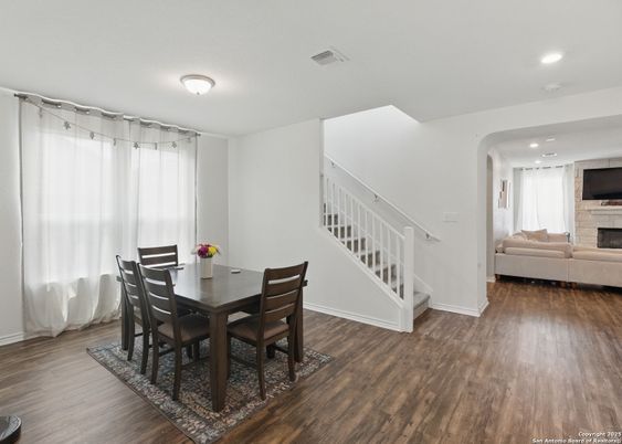 Dining room, Fireplace, Interior, Living room, Recessed Lighting, Wood Texture Flooring