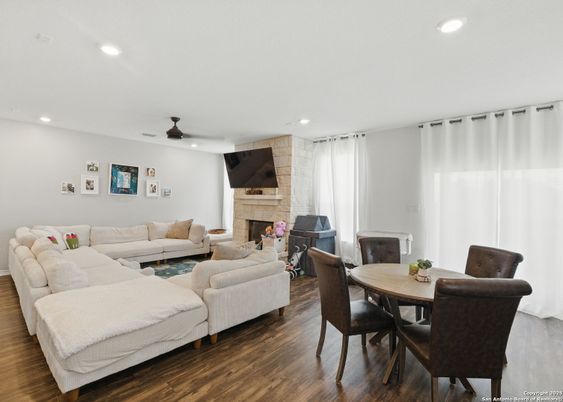 Dining room, Fireplace, Interior, Living room, Recessed Lighting, Wood Texture Flooring
