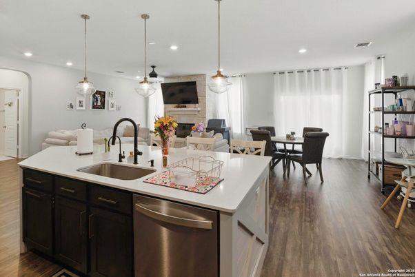 Dining room, Interior, Kitchen, Pendant Lights, Recessed Lighting, Stainless Steel Appliances, Wood Texture Flooring