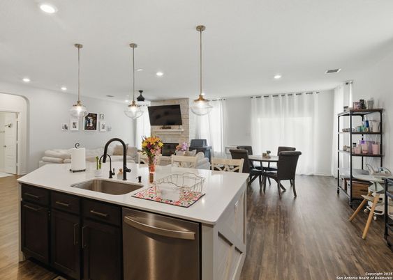 Dining room, Fireplace, Interior, Kitchen, Living room, Pendant Lights, Recessed Lighting, Stainless Steel Appliances, Wood Texture Flooring