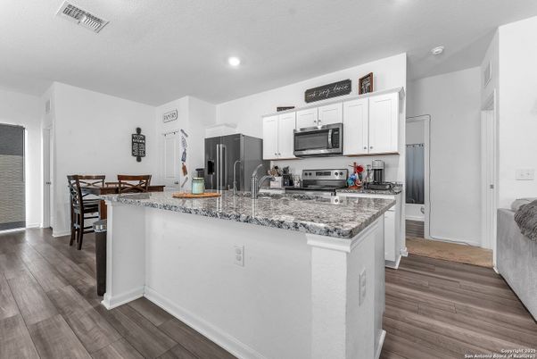 Dining room, Interior, Kitchen, Recessed Lighting, Stainless Steel Appliances, Wood Texture Flooring