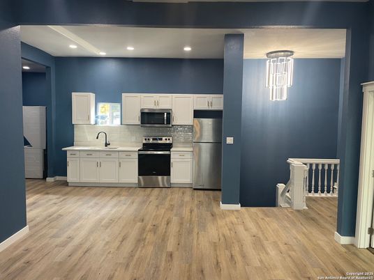 Interior, Kitchen, Pendant Lights, Recessed Lighting, Stainless Steel Appliances, Wood Texture Flooring