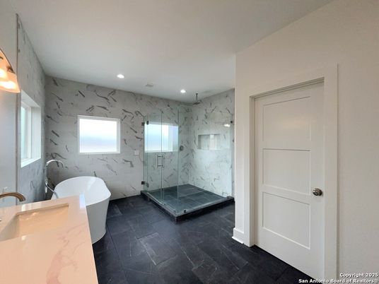 Bathroom, Free Standing Baths, Glass Shower, Interior, Marble Walls, Recessed Lighting