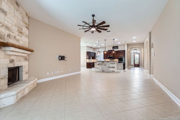 Empty room, Fireplace, Interior, Kitchen, Pendant Lights, Recessed Lighting, Stainless Steel Appliances