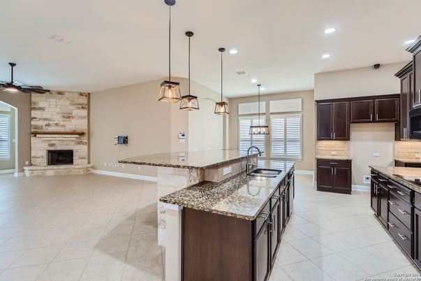 Fireplace, Interior, Kitchen, Marble, Pendant Lights, Recessed Lighting, Stone Walls