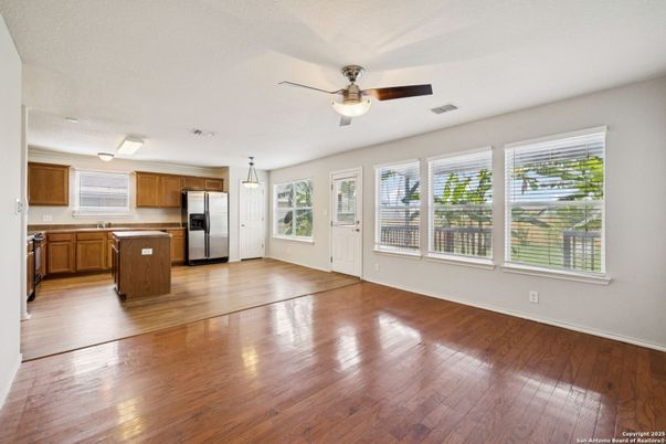 Empty room, Interior, Kitchen, Pendant Lights, Stainless Steel Appliances, Wood Texture Flooring