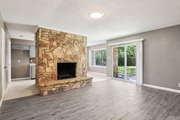 Empty room, Fireplace, Interior, Recessed Lighting, Stone Walls, Wood Texture Flooring