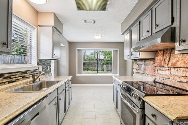 Interior, Kitchen, Recessed Lighting, Stainless Steel Appliances, Stone Walls