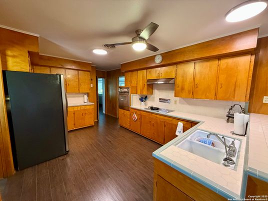 Interior, Kitchen, Recessed Lighting, Tile Countertops, Wood Texture Flooring