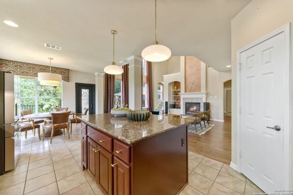Dining room, Fireplace, Interior, Pendant Lights, Recessed Lighting, Wood Texture Flooring