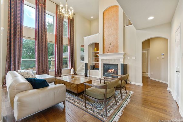 Chandelier, Fireplace, Interior, Living room, Recessed Lighting, Wood Texture Flooring