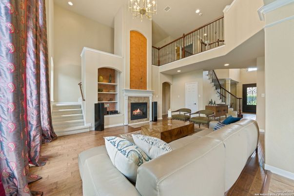 Chandelier, Fireplace, Interior, Living room, Recessed Lighting, Wood Texture Flooring