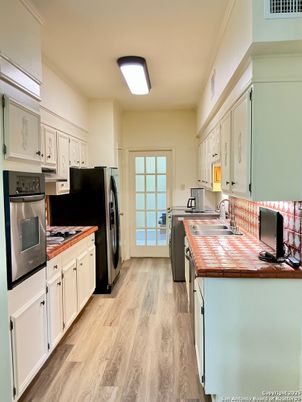 Interior, Kitchen, Tile Countertops, Wood Texture Flooring