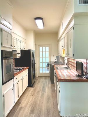 Interior, Kitchen, Tile Countertops, Wood Texture Flooring