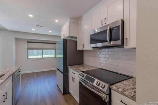 Interior, Kitchen, Recessed Lighting, Stainless Steel Appliances, Wood Texture Flooring