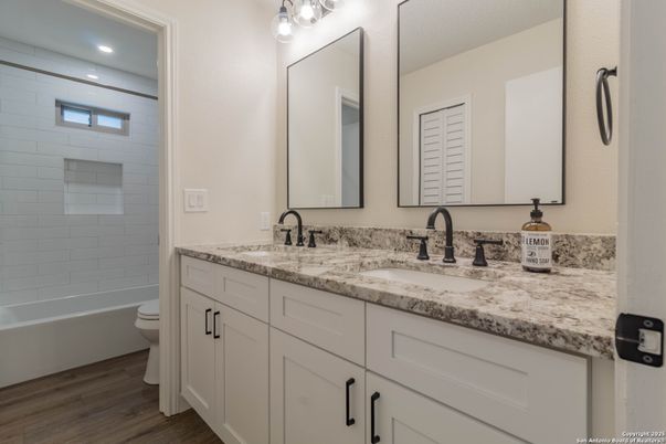 Bathroom, Dual Sink Vanities, Interior, Recessed Lighting, Wood Texture Flooring
