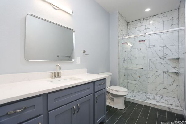 Bathroom, Glass Shower, Interior, Marble Walls, Recessed Lighting, Wood Texture Flooring
