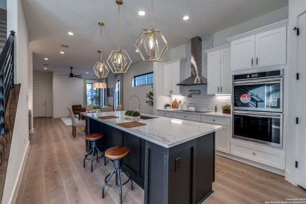Dining room, Interior, Kitchen, Pendant Lights, Recessed Lighting, Stainless Steel Appliances, Wood Texture Flooring