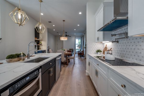 Dining room, Interior, Kitchen, Pendant Lights, Recessed Lighting, Stainless Steel Appliances, Wood Texture Flooring