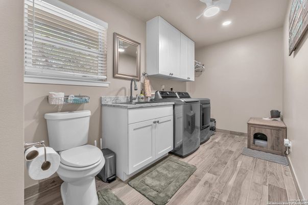 Bathroom, Interior, Recessed Lighting, Washer, Wood Texture Flooring