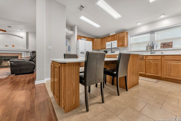 Dining room, Fireplace, Interior, Kitchen, Recessed Lighting, Wood Texture Flooring