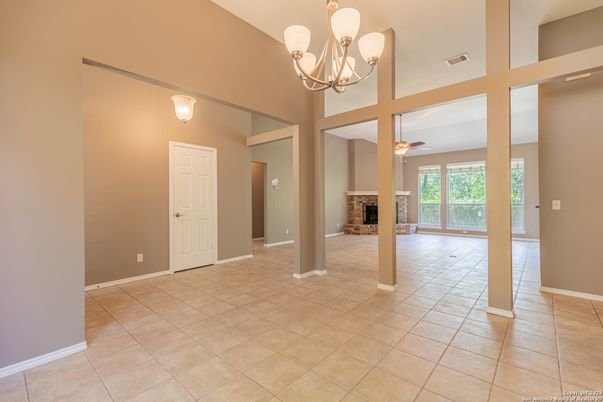 Chandelier, Empty room, Fireplace, Interior
