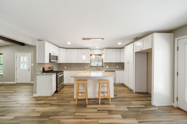Interior, Kitchen, Pendant Lights, Recessed Lighting, Stainless Steel Appliances, Wood Texture Flooring