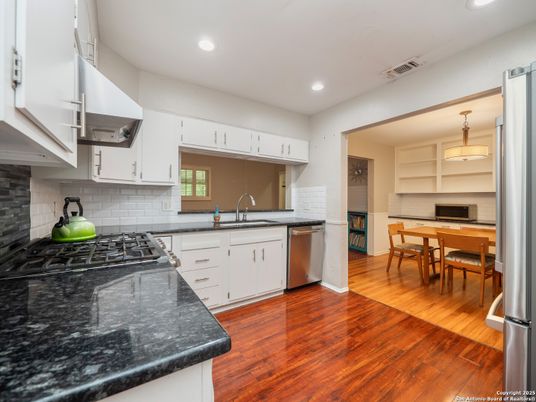 Dining room, Interior, Kitchen, Recessed Lighting, Stainless Steel Appliances, Wood Texture Flooring